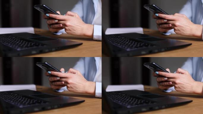匿名女商人手持智能手机，通过手机键入短信