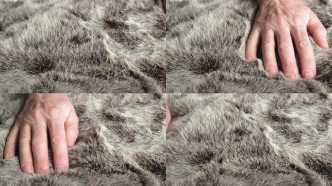 设计师检查人造毛皮的质量是否适合缝制。时尚和动物福利的概念。