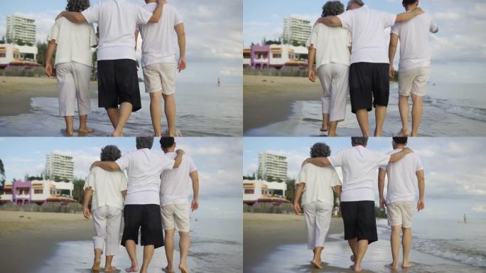 一个家庭的4k视频片段在海滩上度过了美好的时光，家庭生活方式的概念
