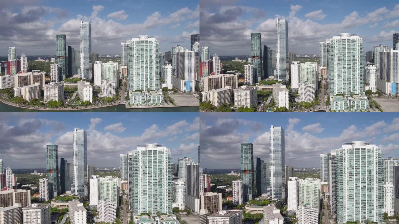海滨迈阿密市中心布里克尔的现代塔楼和摩天大楼的鸟瞰图。无人机制作的视频剪辑，带有转发摄像机运动。