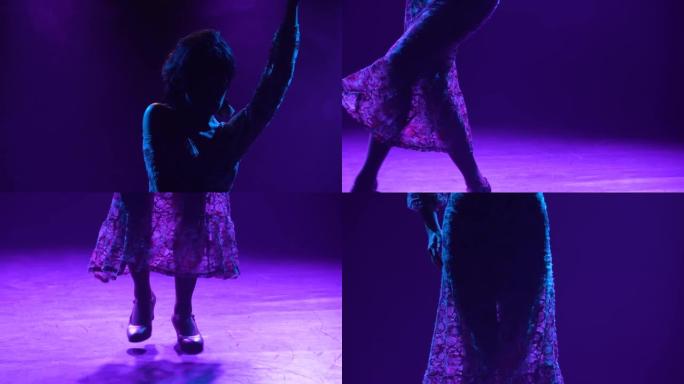 穿着蕾丝连衣裙跳舞的迷人黑发女郎的剪影，用手表演优美的动作。女人在紫色灯光的黑暗烟熏工作室里跳舞弗拉