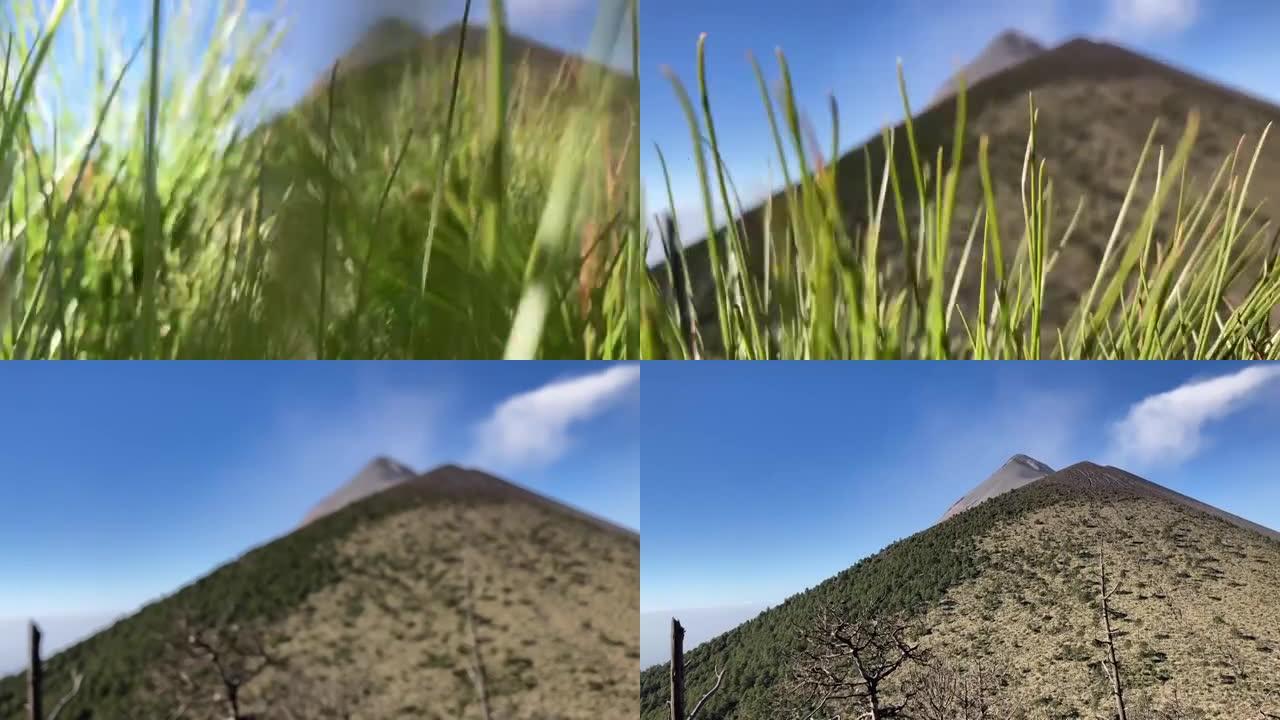 在美丽的晴天 (2021年4月1日) 中，穿过灌木丛，让位于活火山和被自然和树木覆盖的山丘