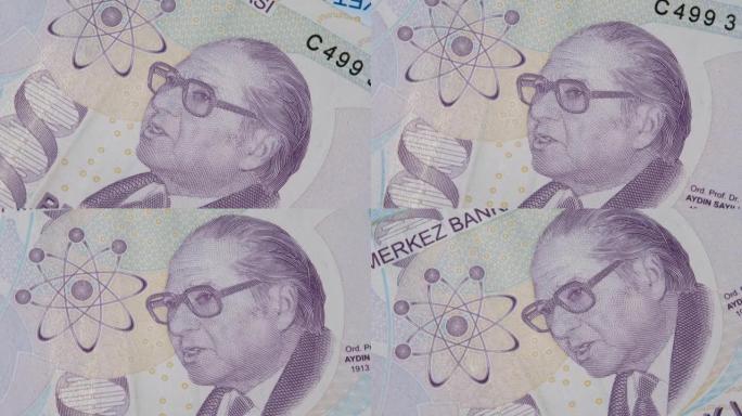 科学史学家艾丁·萨伊利 (Aydin Sayili) 在紫色5土耳其里拉钞票的反面
