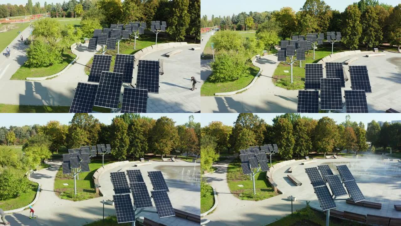 在波兰华沙喷泉附近的城市公园里，一排排着太阳能电池板的无人机视图。