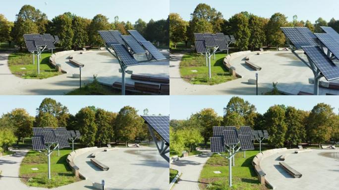 公园喷泉上一排排太阳能电池板，在阳光明媚的夏日，无人机可以看到太阳能发电厂的景色。