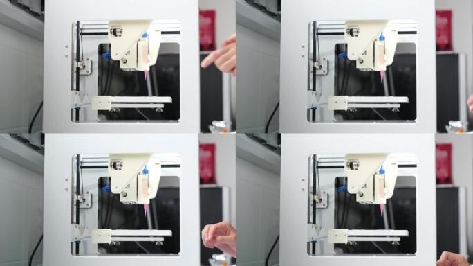 研究人员加载墨盒并将3D生物打印机调整到3D打印单元到电极上。4k视频。