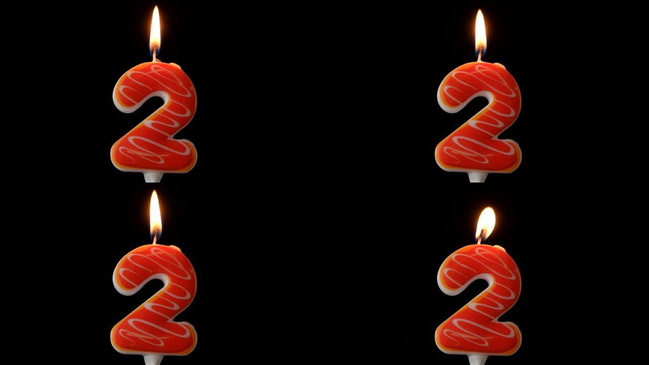 生日燃烧两支蜡烛。生日快乐背景周年概念