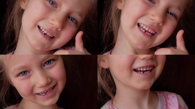 害怕的小女孩6-7岁失去了较低的乳牙。可爱的学龄前儿童摇晃着牙齿，微笑着。4k镜头黑暗背景。
