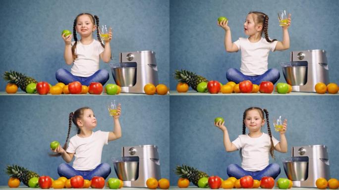 喝杯橙汁的女孩。小女孩用自制果汁吃苹果