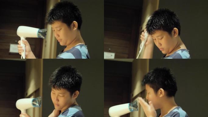 快乐的亚洲男孩在度假期间与家人一起在酒店的房间里吹干头发，生活方式理念。