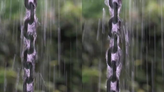 雨水撞击摆动的金属链。
