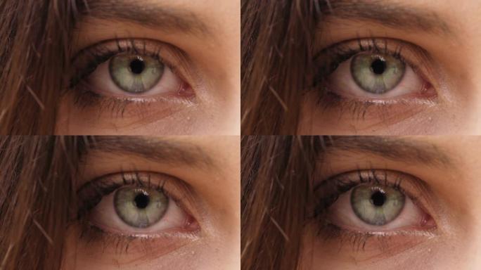 女人眼睛的细节睁开并凝视着相机-微距