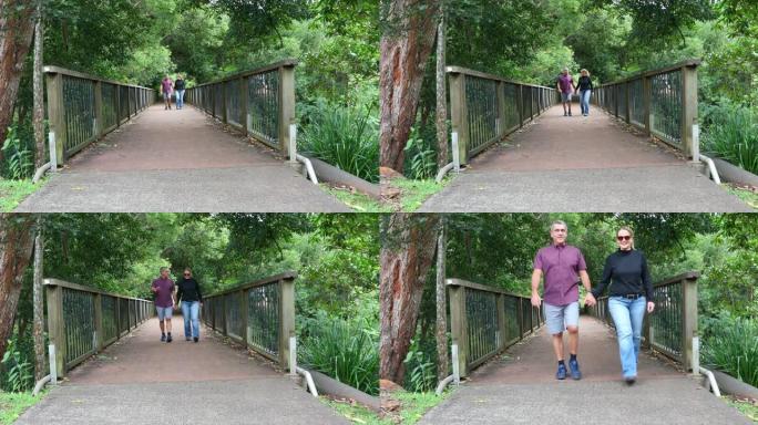 成熟的毛利人和他的妻子一起在公园散步