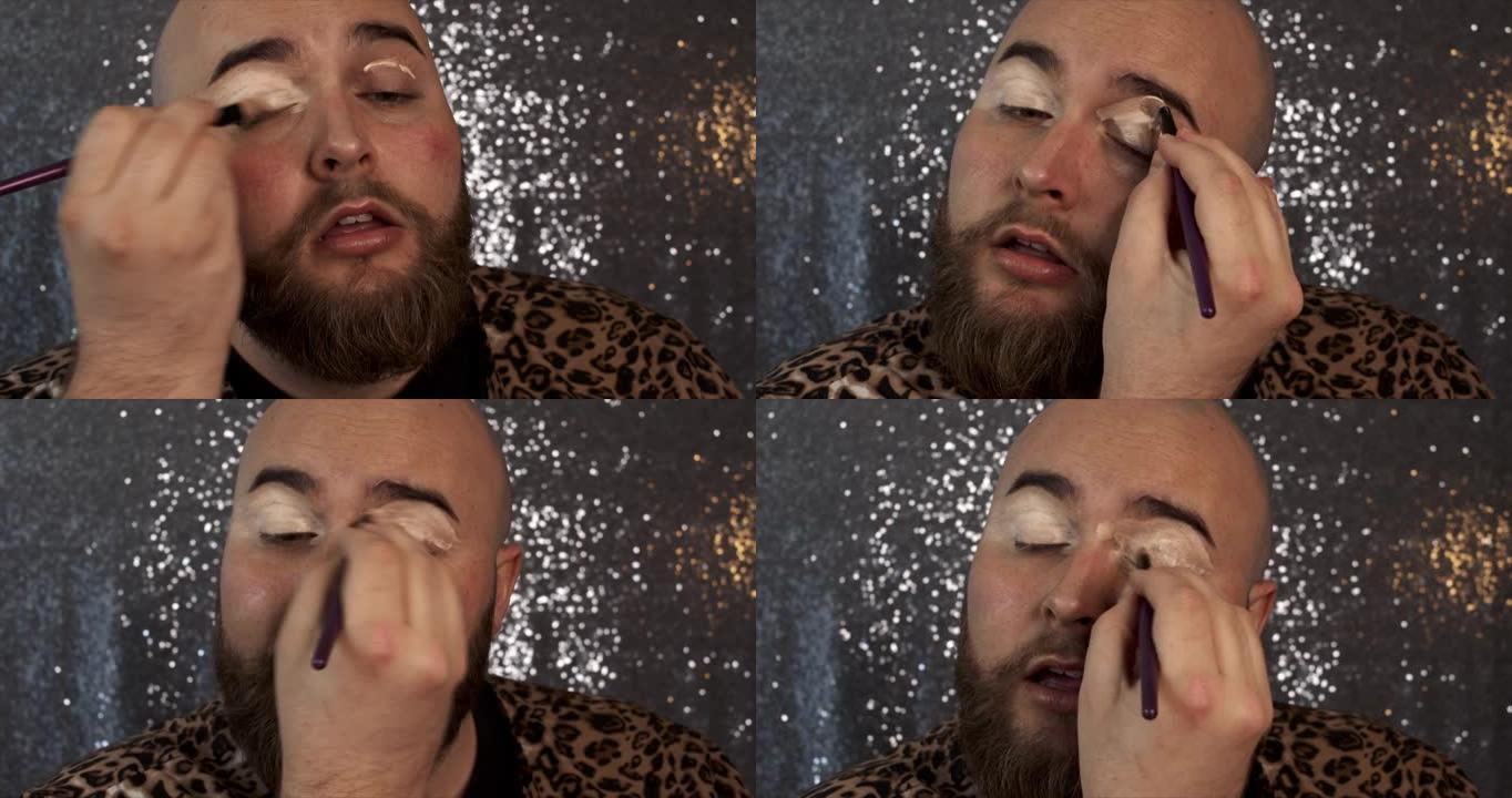 一名男性化妆师混合他的眼影底漆的4k视频片段