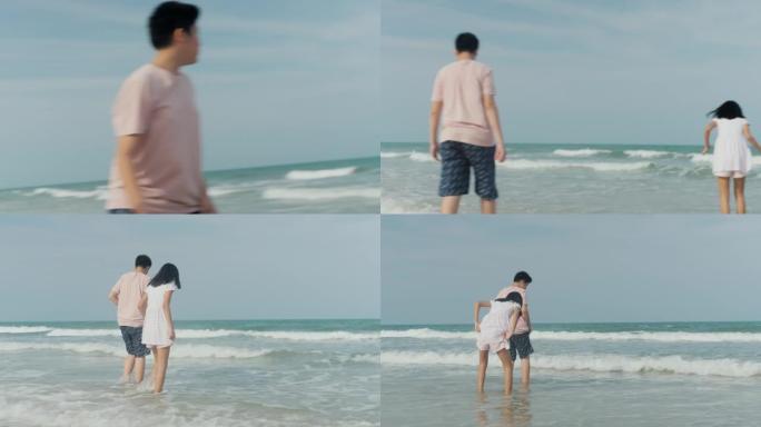 快乐的亚洲男孩和女孩一起在海滩上玩耍，同时在假期和家人一起放松，生活方式理念。