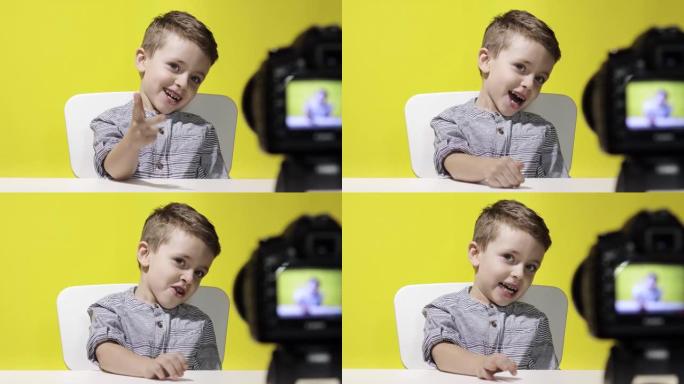 儿童博客在家里录下他的视频博客。男孩录制他的视频博客。小视频记录器使用相机进行在线流媒体。