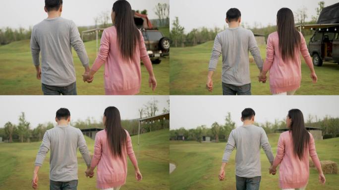 亚洲夫妇在公园散步时手牵手。