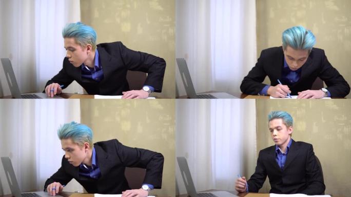 年轻的上班族，有文件，看着笔记本电脑，台式机，员工，表格