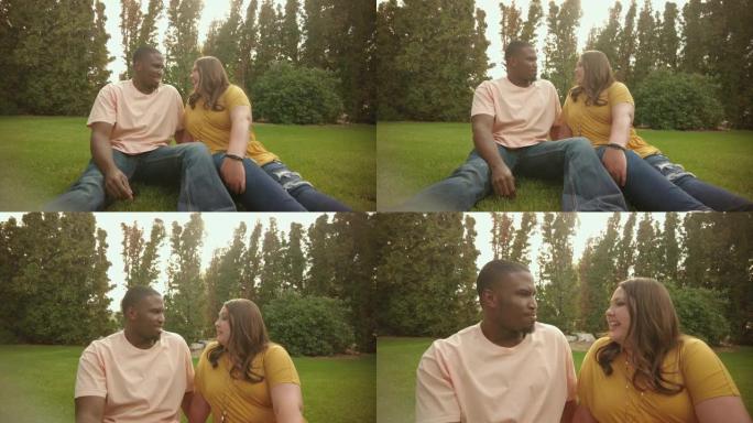 混血夫妇非裔美国男性和高加索女性户外手牵手跳舞，一起度过高质量的约会时间4k视频系列