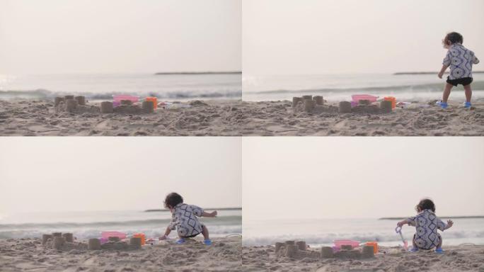 小男孩喜欢在海上玩沙子。