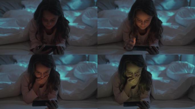 夜间电影儿童床休闲女孩看手机