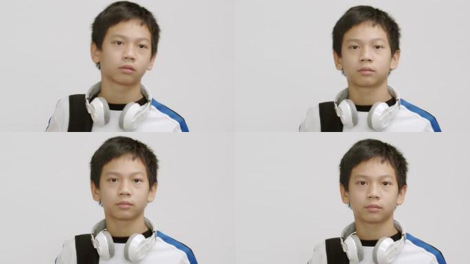 亚洲男孩看着相机。
