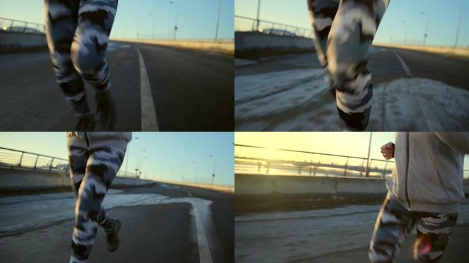 穿着迷彩绑腿的女性腿的特写镜头沿着道路奔跑。