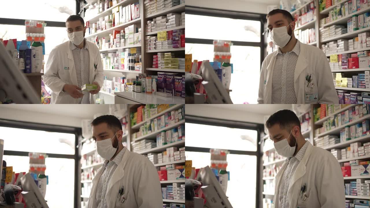 男性药剂师在计算机上填写处方，并将药物与侧面分开，为客户