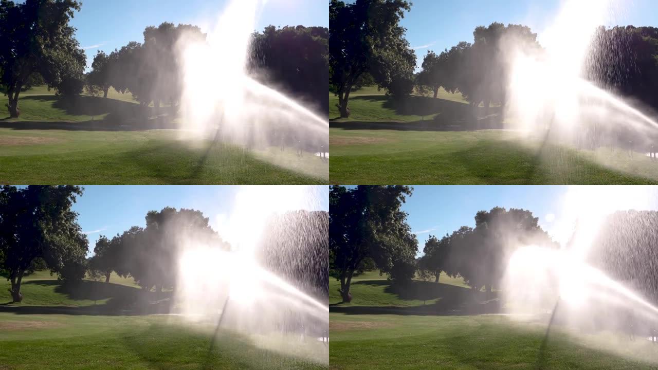 在西班牙阳光明媚的夏日，喷射着水在高尔夫球场上浇水