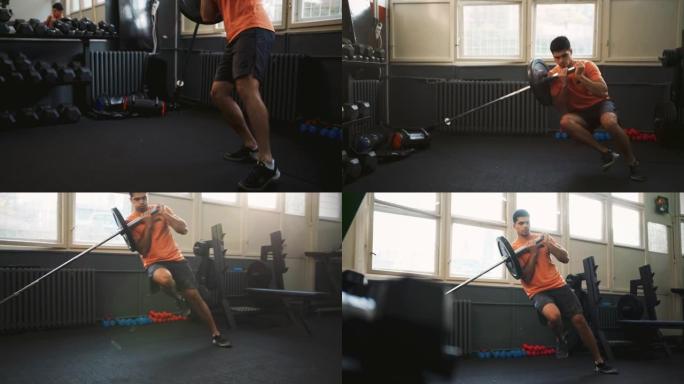 运动男子在健身房做单腿地雷深蹲运动
