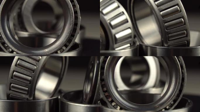 循环无缝视频，轴承在黑色背景的转盘上旋转。