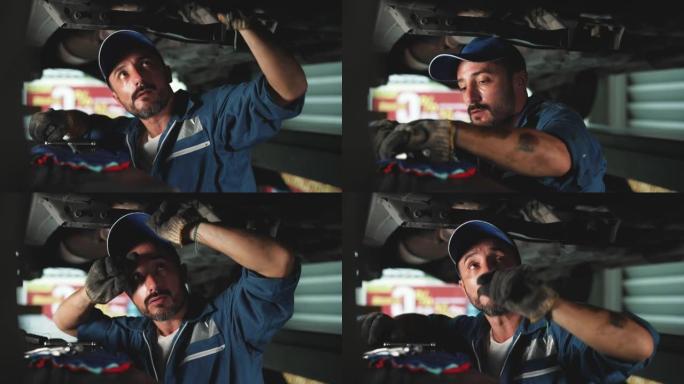 修理工在汽车服务中工作。