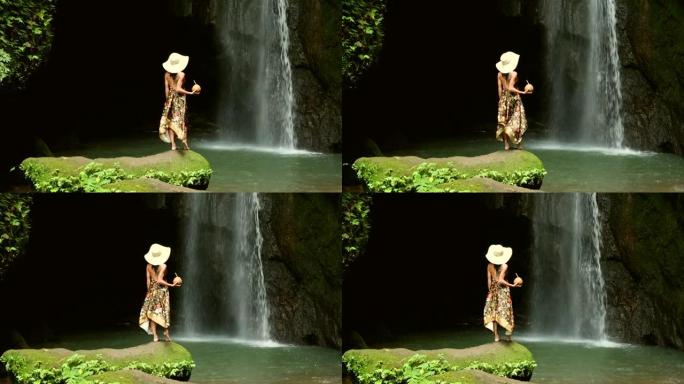 热带瀑布背景下的女模特快乐性感