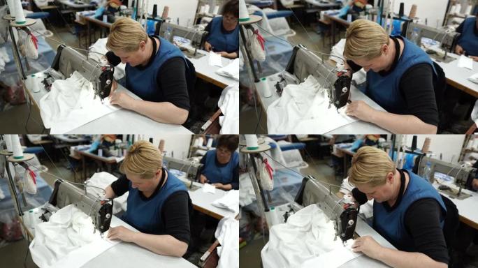 专业裁缝时装设计师用缝纫机缝制衣服