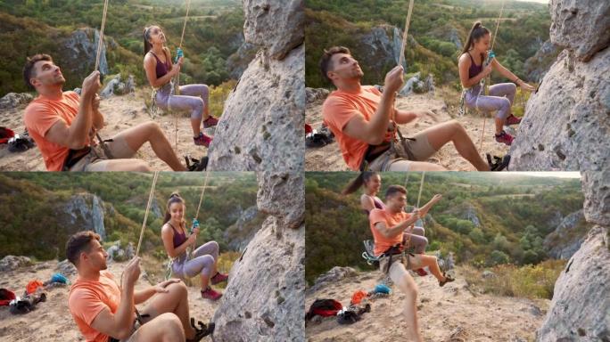 年轻夫妇在攀岩上玩得开心
