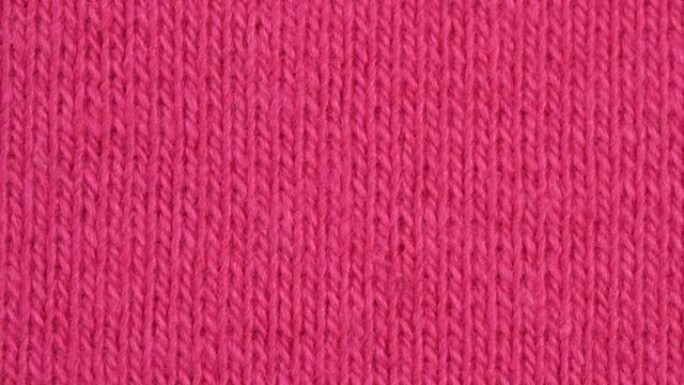 纺织背景-粉色棉弹性弹性织物。微距拍摄。