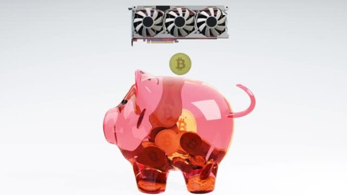 比特币加密货币挖掘概念比特币加密货币的金币从视频卡掉入玻璃透明的粉红色存钱罐中。金融成功的象征。现金