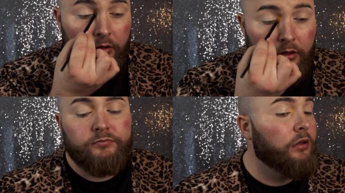 一名男性化妆师在眼睛内角上涂抹眼影的4k视频片段