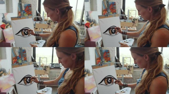 女艺术家用油漆画棕色的眼睛