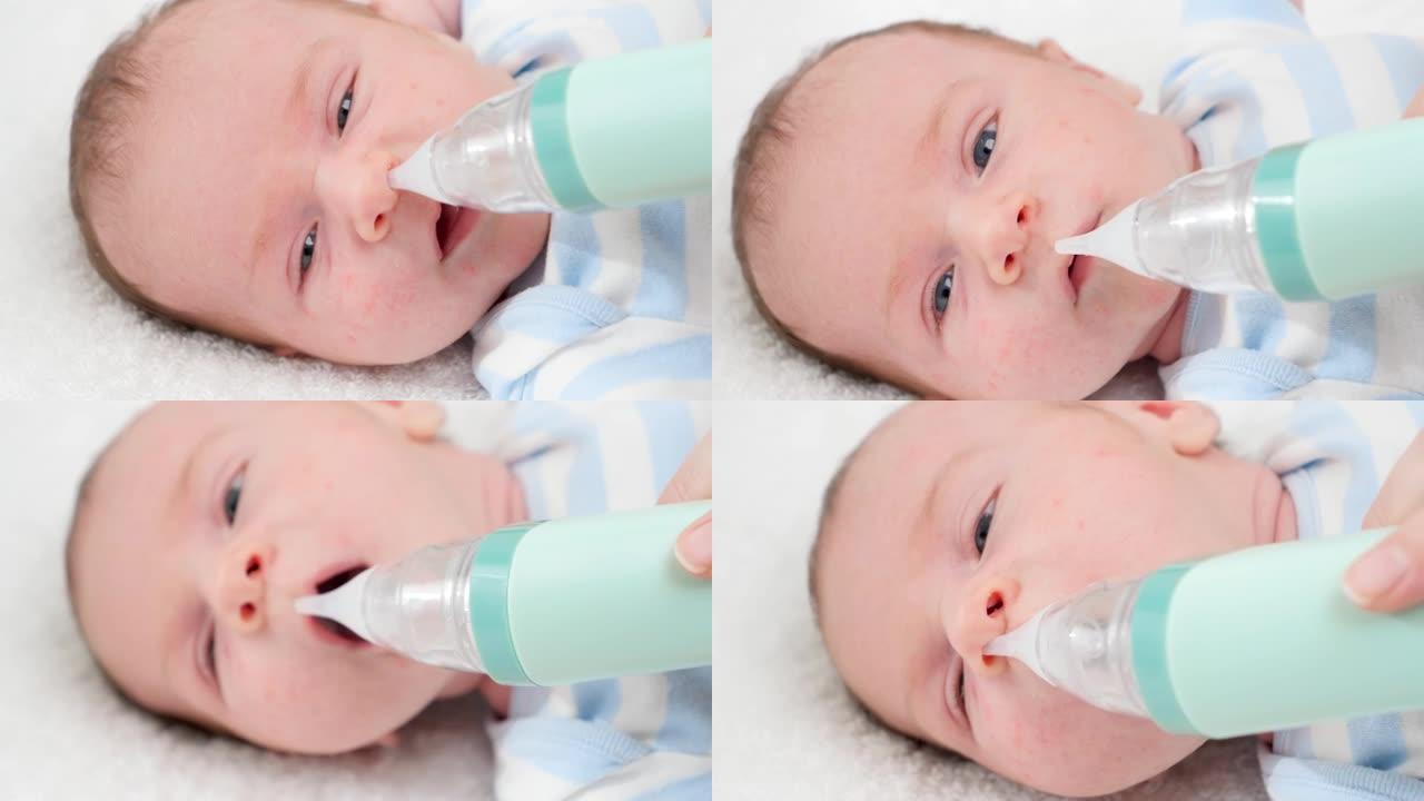 用电动吸气器清理新生婴儿小鼻子的特写慢动作。婴儿和新生儿卫生保健的概念。有小孩的有爱心的父母。