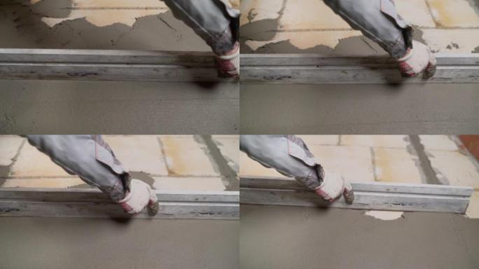 在家装修。抹灰师在墙上铺石膏。在砖上撒上水泥。工人在墙上涂抹并平砂浆。