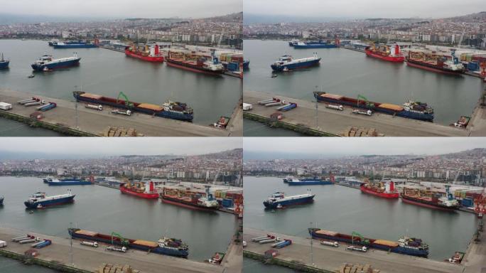 接近国际集装箱港口的货船的鸟瞰图。4k分辨率。