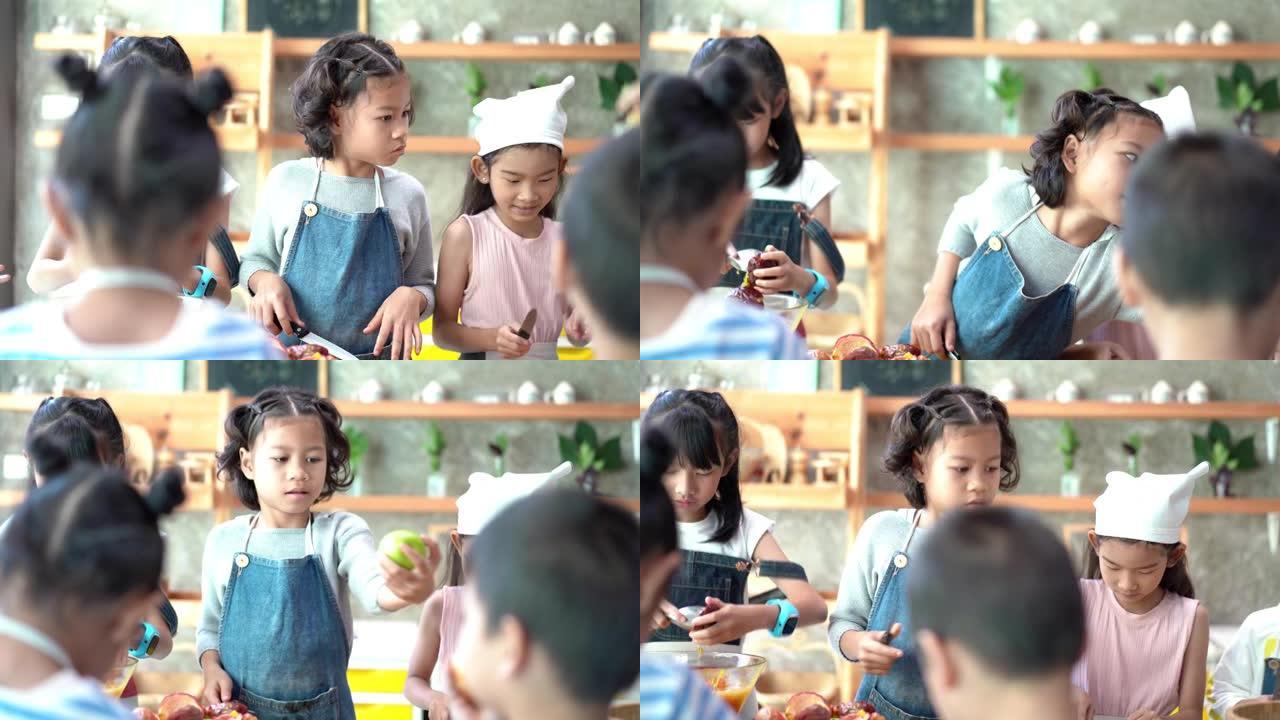 童年的学生和朋友在学校课堂上学习如何在厨房做饭