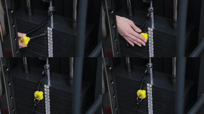 美丽的年轻女子在模拟器上调整重量