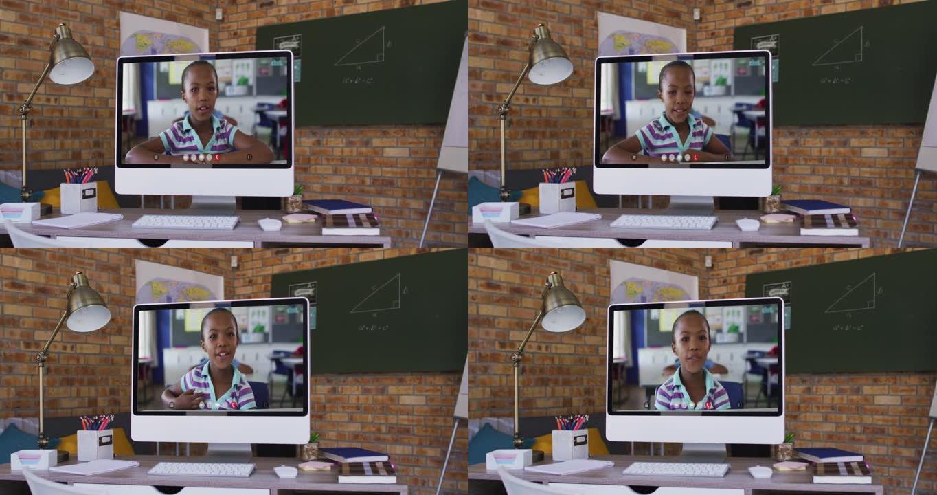 非裔美国女学生的网络摄像头视图在学校桌子上的电脑上进行视频通话