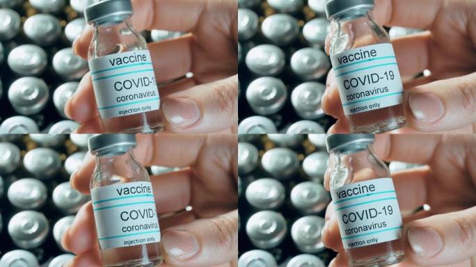 妇女手握冠状病毒疫苗瓶中的药理学药物瓶背景针对全球大流行