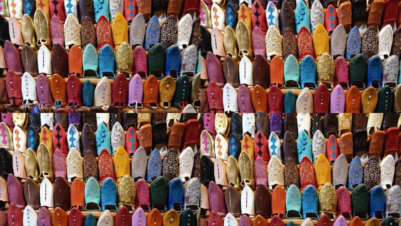 摩洛哥马拉喀什 (马拉喀什) 麦地那的地道彩色摩洛哥妇女拖鞋 (babouches) 刺绣，陈列在墙