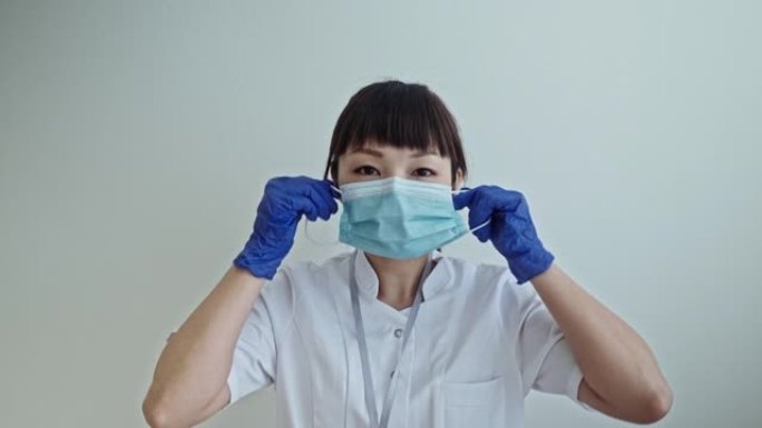 亚洲前线工人戴上面罩的肖像