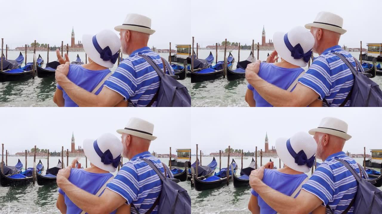退休的高级夫妇在威尼斯度假。吹捧者养老金领取者的后视图看大运河