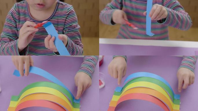 年轻女孩手工制作家庭教育用纸彩虹工艺